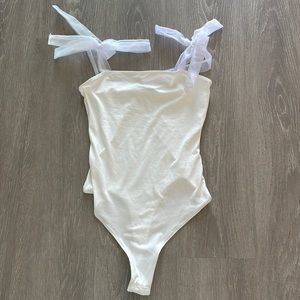 VICI white bodysuit